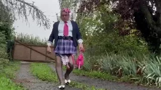 Dressed in a little pink plaid skirt for a party