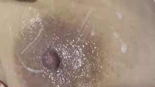 Mom plays with her cream on her delicious huge tits