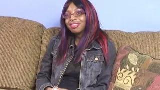 Black Chick with Nipple Rings on Her Big Tits Spreads Her Legs on the Couch