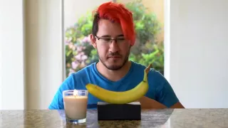 Sexy interracial man contemplates shoving a rock hard banana up his hole