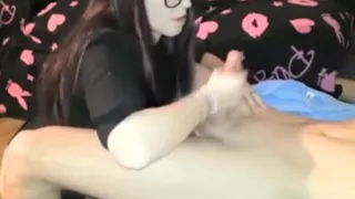 Girl In Glasses Strokes Her Man'S Dick