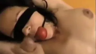 Blindfolded Brunette Bitch Stroking And Gagging Penis That
