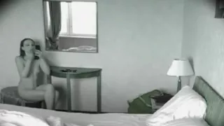 Attractive brunette loves to lounge around her bedroom nake