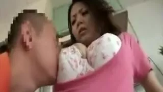 Bodacious Japanese cougar has a horny boy caressing her swe