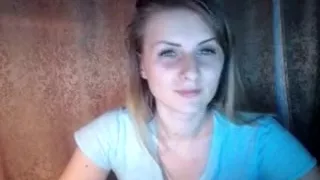 Horny blonde babe raises her blue top to show her nice tits