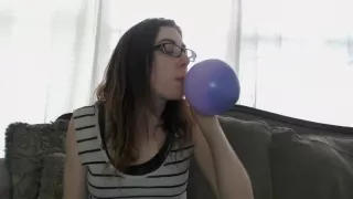 Sammy blows up a balloon with smoke then pops it