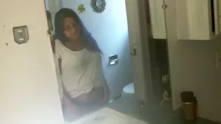 voyeur smoking in front of a mirror