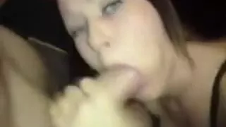 Gorgeous woman with attractive eyes sucking on dick