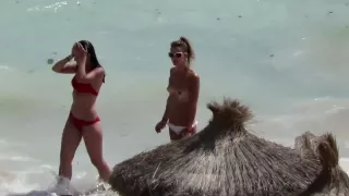 I can't wear a bra because of new tattoo! Beach Voyeur