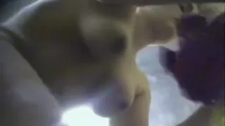 Big-breasted young woman takes off her clothes to dry her n