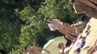 Young nudists take off their clothes to soak up some sun on