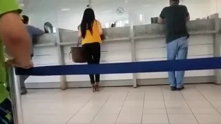 Watch a spy cam of a sexy brunette with a perfect ass stand