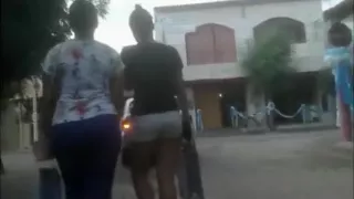 Hidden camera follows two sexy girls in tight clothes walki