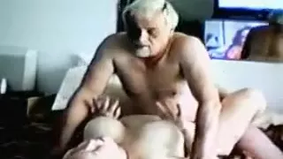 Older Man Beating Partner On Bed