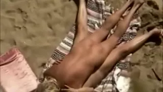 Outdoor sex on beach filmed through from top by a voyeur cam