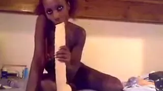Naughty black babe on webcam fucks herself with huge dildo and teasing