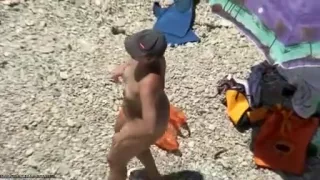Voyeur cam view of horny couple fucking on public beach