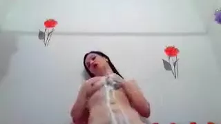 Pretty CrazyTina bathes in a bathroom