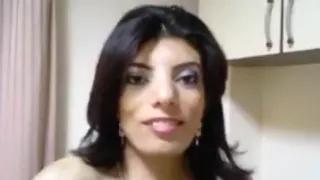 Ugly dark haired girl with big boobs fingers her shaved pussy standup in her bedroom