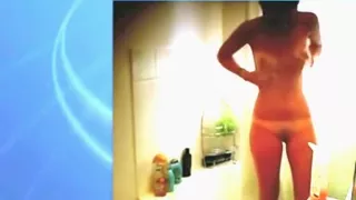 Voyeur captures a hot nerdy girl with glasses naked in the shower