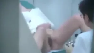 Voyeur tapes a brunette with trimmed pussy getting a gynaecology exam