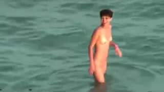 Voyeur tapes a couple having sex in the sea and on the beach