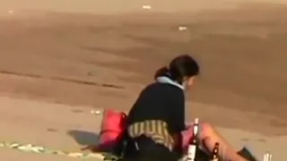 voyeur tapes a crazy girl riding her boyfriend  upskirt at the beach