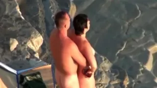 voyeur tapes a nudist woman riding her boyfriend  at the beach