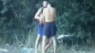 Voyeur tapes a slut having a threesome with 2 guys in the lake