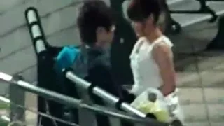 Voyeur tapes an asian girl couple having sex on a bench in the park