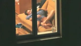 Voyeur tapes the neighbors having sex on the sofa