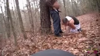 White streetslut sucks off a fat black guy in the forest