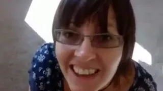 Amateur brunette wearing glasses sucks a cock in POV clip