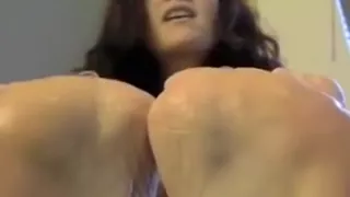 Dark-haired amateur cutie massages her oiled feet in homemade solo