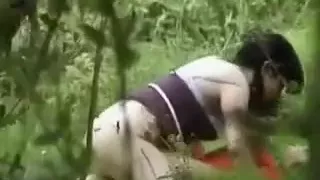 Energetic girl with nice ass is straddling her lover outdoors