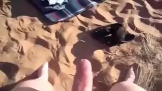 My wife fingers her pussy on a beach after sucking my cock