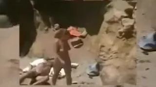 Redhead milf sucks her man's dick and takes a ride on it on a beach