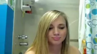 yellow-haired young gets naked in the bath