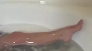 All oiled up chick playing with her slit