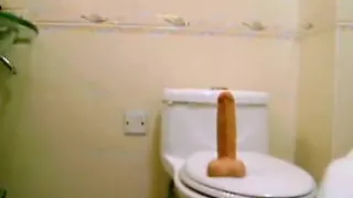 big beautiful woman oriental toying her fur pie in crapper