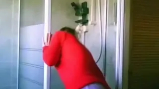 Cute blond taking a shower