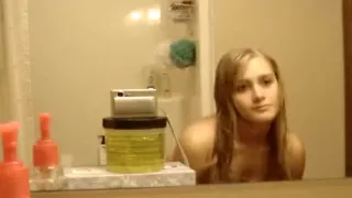 Nude blonde model posing solo