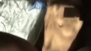 Spreading her trimmed vagina wide