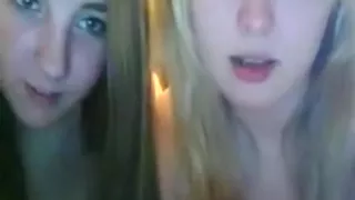 A blonde and brunette girl fool around naked on cam