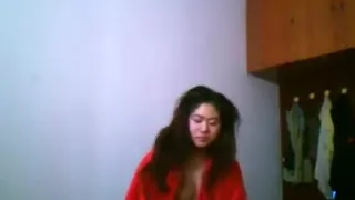 Asian girl with big boobs changes clothes in her bedroom
