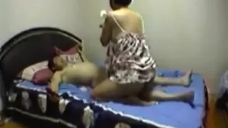 Asian milf gives her man a handjob and gets doggystyle and missionary fucked
