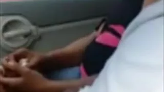 Black streetslut gives a guy head in his car