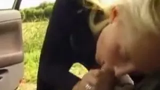 Blonde uk girl gives her man a blowjob, while he's driving on the highway.