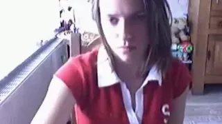 Brunette girl gets naked and fingers her trimmed pussy on a chair