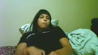 Brunette girl's face goes into orgasm mode, as she has cybersex with her bf.